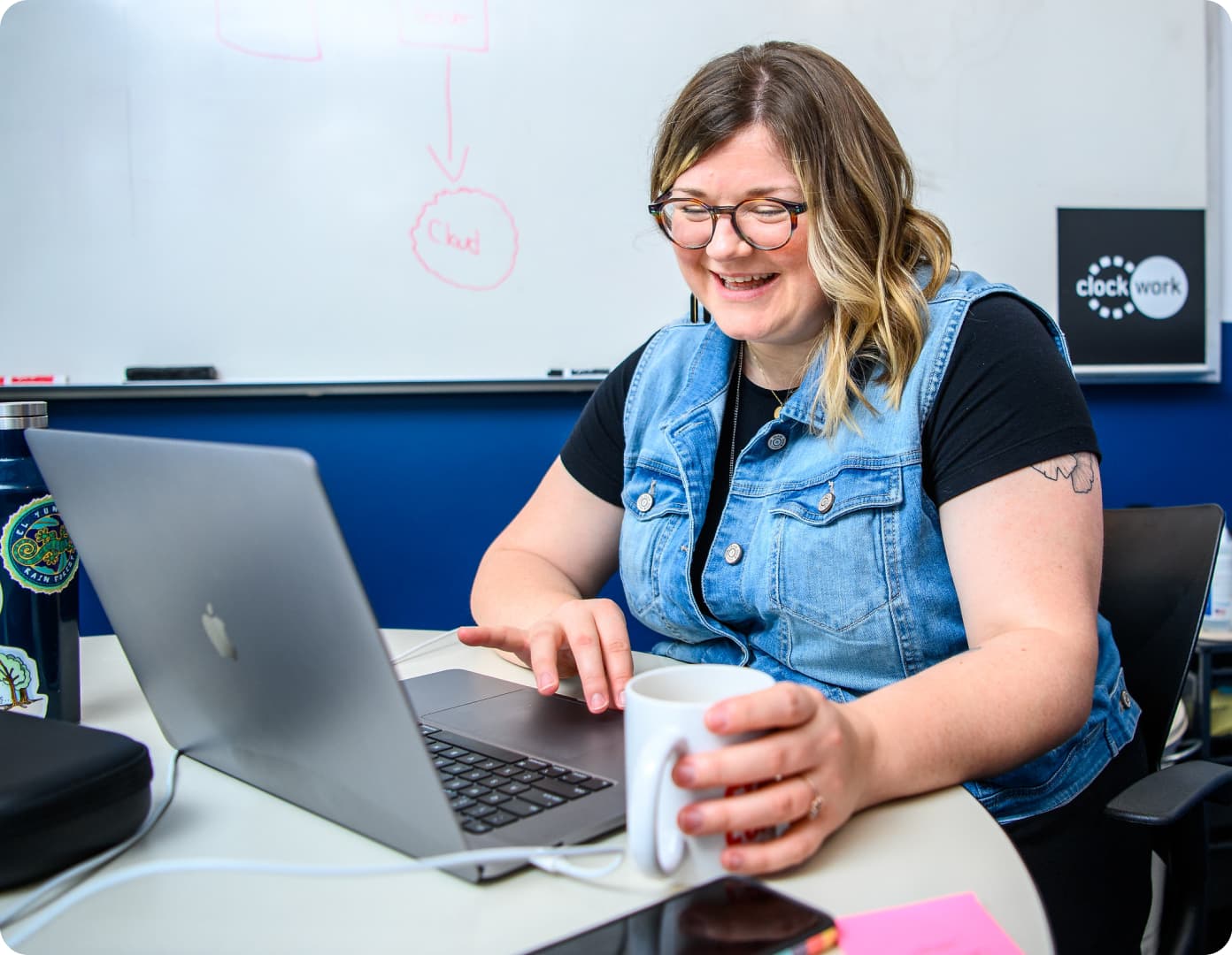 Client strategist working with coffee in hand