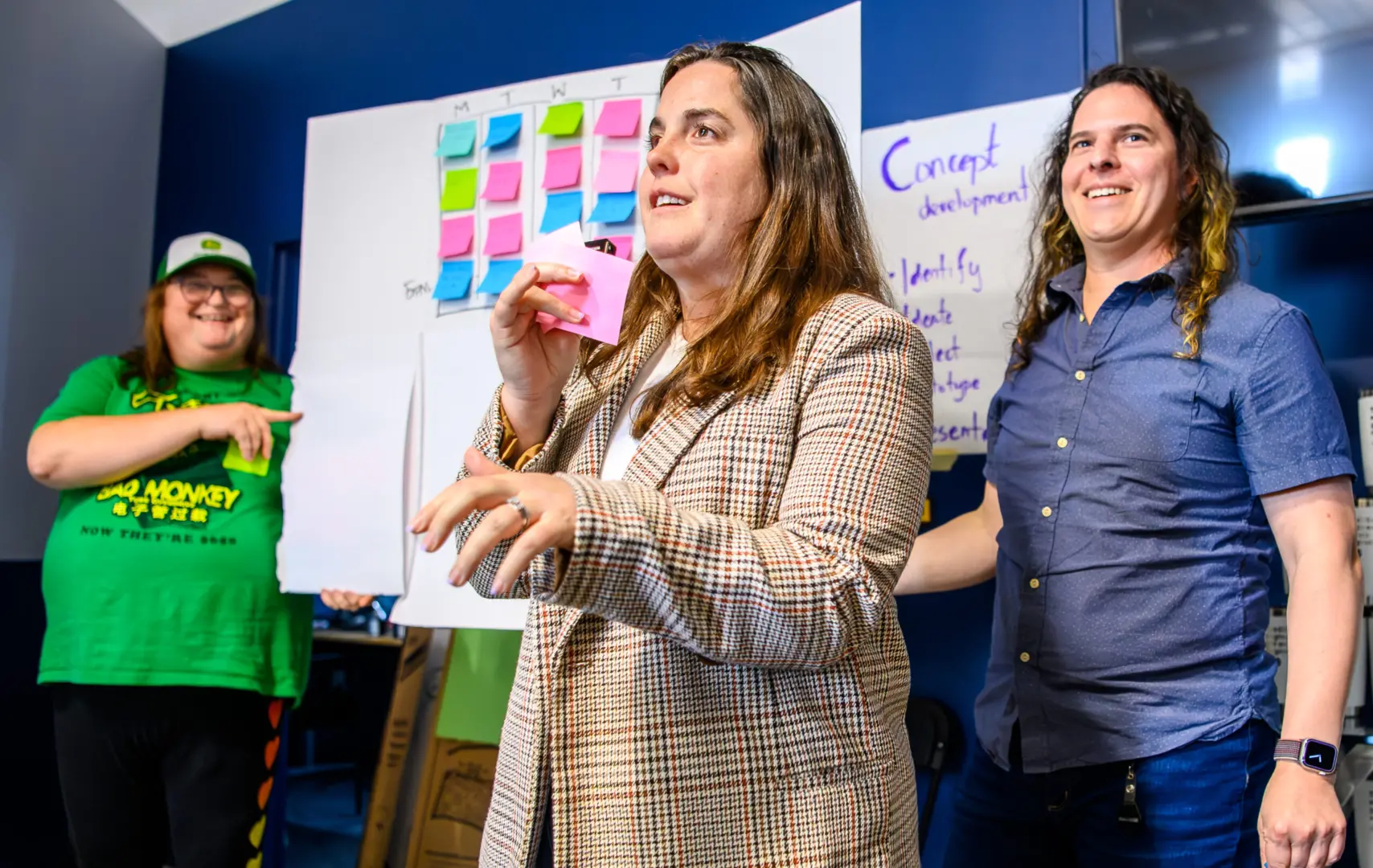 Three members of Clockwork staff presenting during a workship