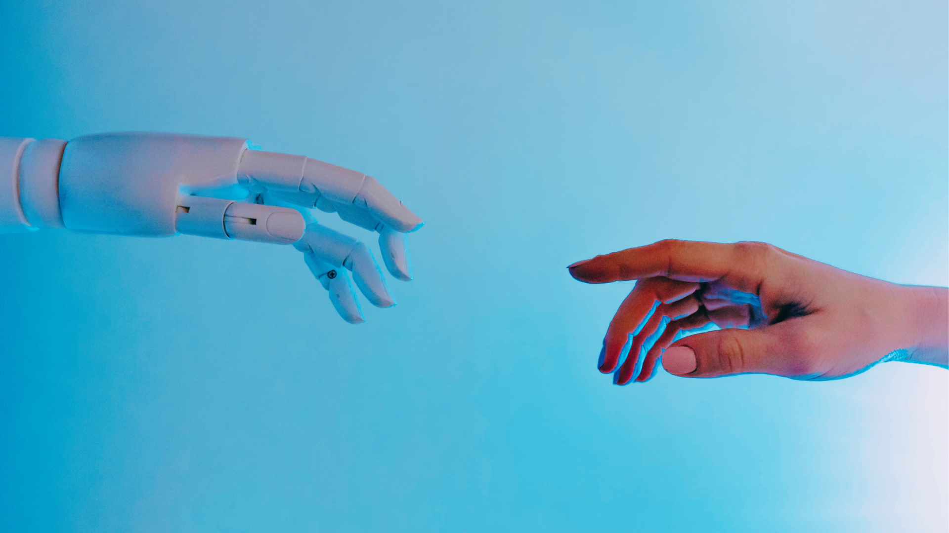 AI robotic and human hands reach toward each other