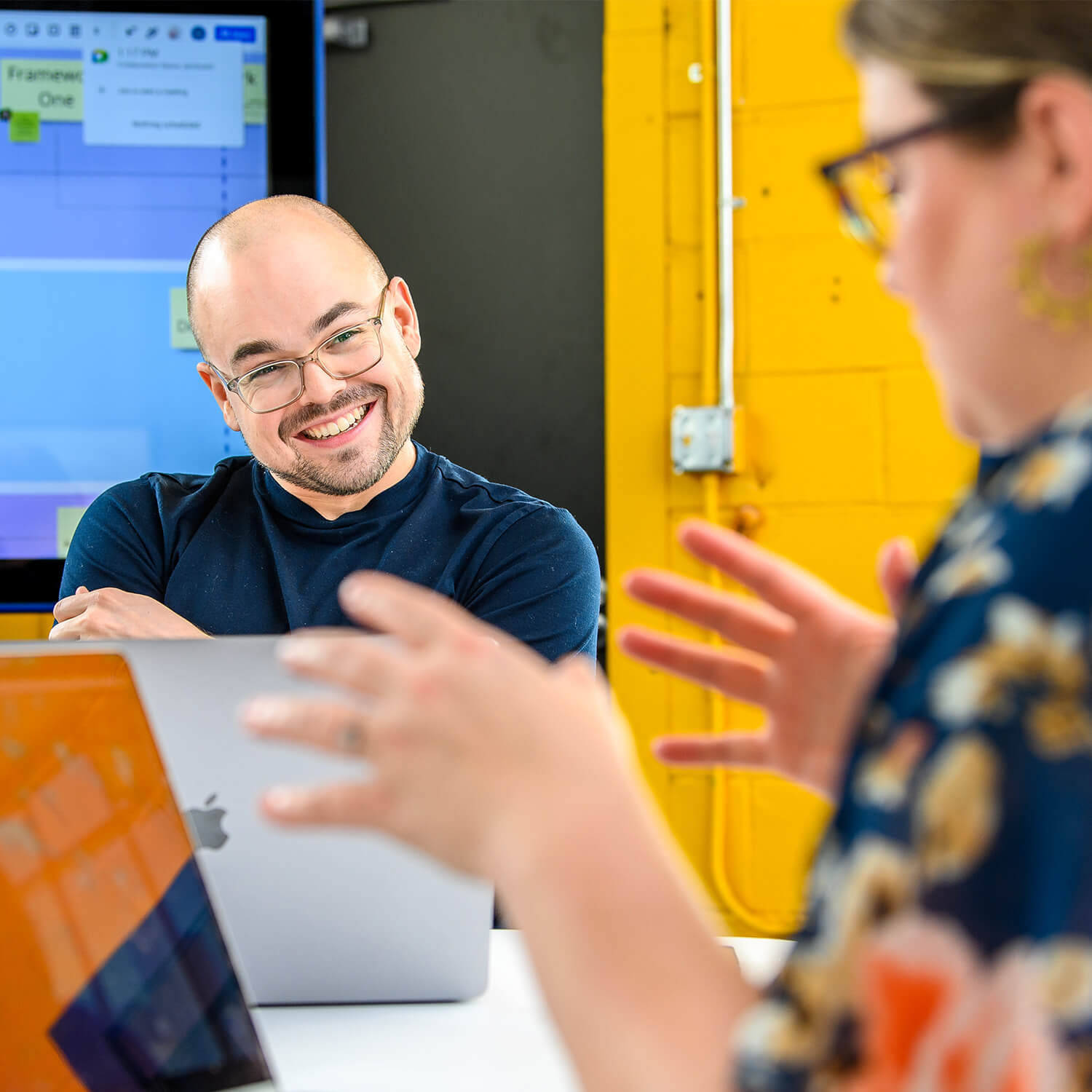 Clockwork employees collaborating in a conference space