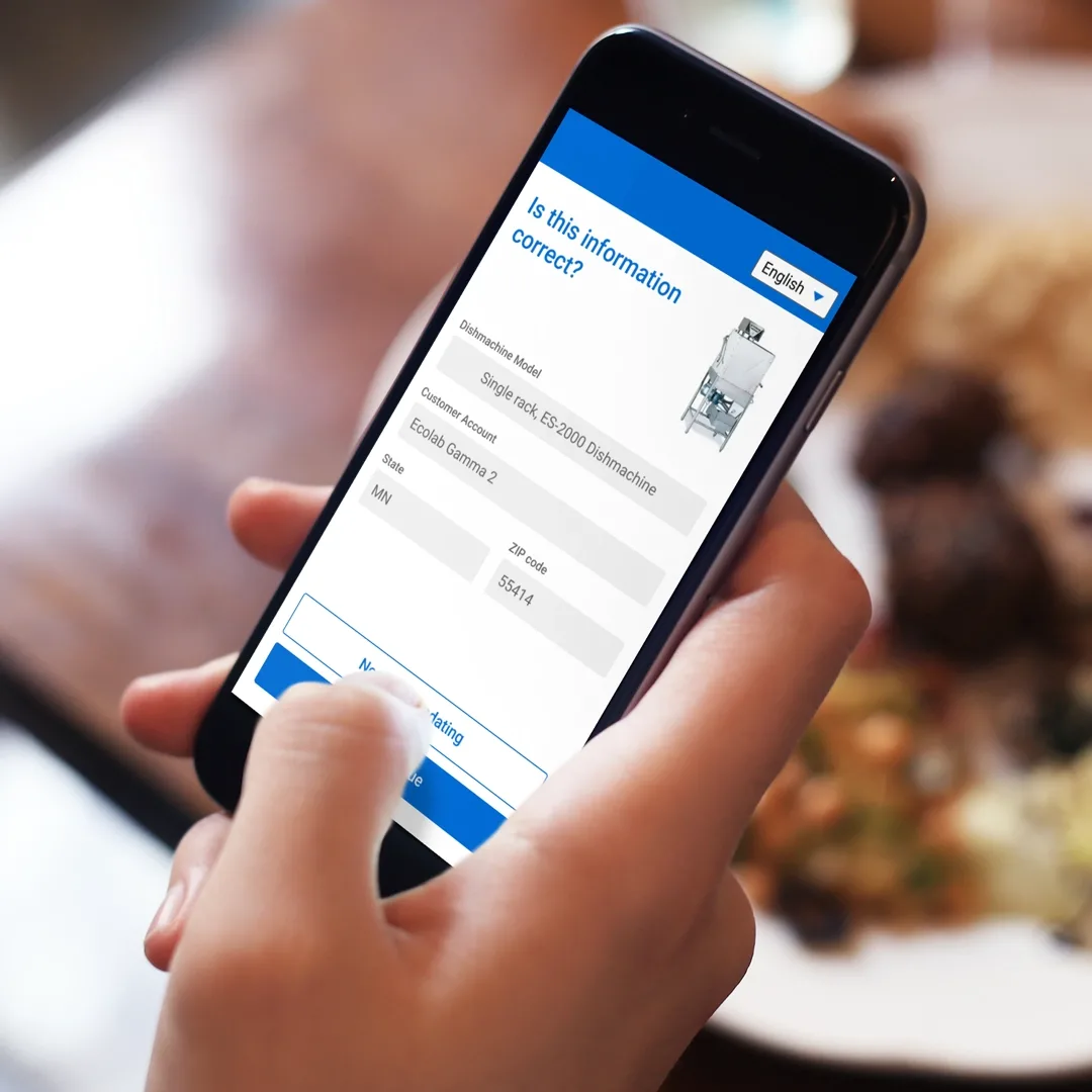 Food worker uses a digital service for equipment help on a mobile device
